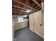 Unfinished basement with painted walls, window, and mechanical features ready for customization at 2626 Fairhaven Dr, Indianapolis, IN 46229