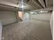 Open basement space with neutral carpet and painted ceilings, ready for customization and finishing at 2626 Fairhaven Dr, Indianapolis, IN 46229