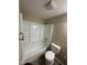 Well-lit bathroom with a combined shower and tub, complemented by a matching toilet at 2626 Fairhaven Dr, Indianapolis, IN 46229