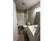 Bright bathroom featuring a white shower, toilet, and vanity with ample lighting at 2626 Fairhaven Dr, Indianapolis, IN 46229