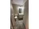 Cozy bathroom featuring a toilet, vanity with mirror, and gray flooring at 2626 Fairhaven Dr, Indianapolis, IN 46229