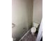 Compact bathroom with essential fixtures including a toilet, towel rack, and white trim at 2626 Fairhaven Dr, Indianapolis, IN 46229