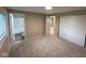 Comfortable carpeted bedroom with access to an en-suite bathroom and closet at 2626 Fairhaven Dr, Indianapolis, IN 46229