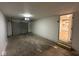 Spacious garage with an overhead door and entry into a brightly lit kitchen at 2626 Fairhaven Dr, Indianapolis, IN 46229