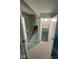 Hallway view with carpeted stairs leading to a finished basement with neutral-toned walls and new flooring at 2626 Fairhaven Dr, Indianapolis, IN 46229