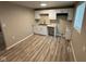 Eat-in kitchen featuring bright lighting, white cabinets, and ample counter space at 2626 Fairhaven Dr, Indianapolis, IN 46229
