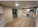 View of newly renovated kitchen featuring all white cabinets and laminate flooring at 2626 Fairhaven Dr, Indianapolis, IN 46229