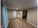 Bright kitchen featuring all white cabinets and laminate flooring at 2626 Fairhaven Dr, Indianapolis, IN 46229