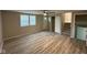 Bright living room with laminate flooring, a ceiling fan, and natural light from a window at 2626 Fairhaven Dr, Indianapolis, IN 46229