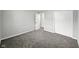 Bedroom with plush carpeting, a closet, and neutral walls at 2853 S State Ave, Indianapolis, IN 46203
