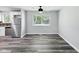 An open concept kitchen flows seamlessly into the living space with stainless steel appliances and ample natural light at 2853 S State Ave, Indianapolis, IN 46203