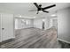 Open concept living space with sleek floors, a modern ceiling fan, and abundant natural light at 2853 S State Ave, Indianapolis, IN 46203