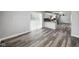Open concept living area with sleek gray flooring and sliding glass doors to the outside at 2853 S State Ave, Indianapolis, IN 46203