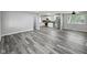 Open living space connecting seamlessly to a modern kitchen with stainless steel appliances at 2853 S State Ave, Indianapolis, IN 46203