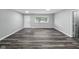 Spacious living room with contemporary flooring, ample natural light, and neutral paint at 2853 S State Ave, Indianapolis, IN 46203