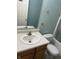 Bathroom featuring a vanity with sink, toilet, and a bathtub with shower at 2929 Tuscarora Ln, Indianapolis, IN 46217