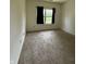 Well-lit bedroom with neutral carpet and a window with black out curtains, and ample closet space at 2929 Tuscarora Ln, Indianapolis, IN 46217