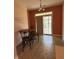 Cozy dining area with direct access to outdoor space, adorned with 'Gathering, Love' wall decor at 2929 Tuscarora Ln, Indianapolis, IN 46217