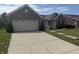 Charming single Gathering home with attached two car garage and a concrete driveway at 2929 Tuscarora Ln, Indianapolis, IN 46217
