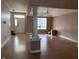 Spacious living room featuring hardwood floors and an abundance of natural light through the large windows at 2929 Tuscarora Ln, Indianapolis, IN 46217