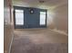 Bright living room featuring neutral carpet flooring, and paint ready for your design at 2929 Tuscarora Ln, Indianapolis, IN 46217