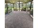 Bright sunroom with large windows offering panoramic views of the backyard and surrounding greenery at 2929 Tuscarora Ln, Indianapolis, IN 46217