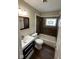 Bathroom showcasing a vanity sink and a tiled shower/tub combo at 3302 N Butler Ave, Indianapolis, IN 46218