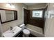 Bathroom showcasing a vanity sink and a tiled shower/tub combo at 3302 N Butler Ave, Indianapolis, IN 46218