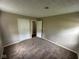Bedroom featuring carpet flooring and double door closet at 3302 N Butler Ave, Indianapolis, IN 46218