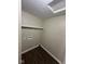 Laundry room featuring washer hookups and upper shelving at 3302 N Butler Ave, Indianapolis, IN 46218