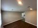 The light and airy living space features sleek, dark-stained wood floors at 3302 N Butler Ave, Indianapolis, IN 46218