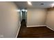 Living room featuring wood flooring and neutral wall paint at 3302 N Butler Ave, Indianapolis, IN 46218