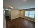 Sunlit living room featuring modern wood floors, neutral walls, and bright windows at 3302 N Butler Ave, Indianapolis, IN 46218