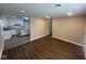 Open-concept living space features stylish wood floors and leads into a modern kitchen at 3302 N Butler Ave, Indianapolis, IN 46218