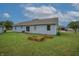 Lawn with raised garden beds on a bright sunny day at 3350 Cessna Dr, Columbus, IN 47203