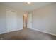 Spacious bedroom with neutral carpet, double closet, and entry to the bathroom, perfect for relaxation at 3350 Cessna Dr, Columbus, IN 47203
