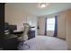 Bright bedroom with a window, beige carpet, and gray walls, creating a serene and inviting space at 3350 Cessna Dr, Columbus, IN 47203