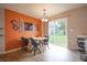Cozy dining area featuring modern decor, stylish furnishings, and access to the backyard at 3350 Cessna Dr, Columbus, IN 47203