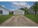View of the concrete driveway leading to the garage and home at 3350 Cessna Dr, Columbus, IN 47203