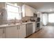 Modern kitchen featuring sleek white cabinets, stainless steel appliances, and ample counter space at 3350 Cessna Dr, Columbus, IN 47203