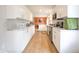 Modern kitchen featuring sleek white cabinets, stainless steel appliances, and ample counter space at 3350 Cessna Dr, Columbus, IN 47203