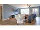 Open-concept living room with sleek hardwood floors, ample natural light, and a comfortable seating arrangement at 3350 Cessna Dr, Columbus, IN 47203