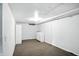 Unfinished basement space with carpet and white walls at 3609 N Keystone Ave, Indianapolis, IN 46218