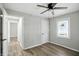 Bright bedroom with vinyl floors, fan, window and connecting door at 3609 N Keystone Ave, Indianapolis, IN 46218