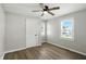 This bedroom has updated vinyl flooring and a ceiling fan for comfort at 3609 N Keystone Ave, Indianapolis, IN 46218