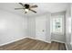 Spacious bedroom features sleek ceiling fan and natural light with vinyl floors at 3609 N Keystone Ave, Indianapolis, IN 46218