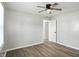 Light bedroom with fan, closet and luxury vinyl flooring at 3609 N Keystone Ave, Indianapolis, IN 46218