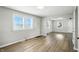 Bright living room boasts wood-look floors and large windows with plenty of natural light at 3609 N Keystone Ave, Indianapolis, IN 46218