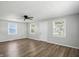 Spacious living room featuring new wood floors, a ceiling fan, and abundant natural light at 3609 N Keystone Ave, Indianapolis, IN 46218