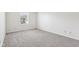 Well-lit bedroom featuring neutral walls and carpet, complemented by a sunlit window at 373 Austin Dr, Avon, IN 46123